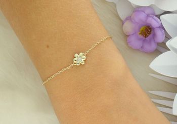 Delikatna bransoletka Nomination Italy z kolekcji Petit Sparkle 242300 012. Srebro 925 pozłacane 18K złotem, ozdobna zawieszka w kształcie kwiatka z cyrkoniami. Regulowana długość 16–19 cm. Orygin.jpg